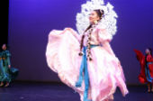 UCSC mainstage performer in a white/pink traditional wardrobe of Michoacan Tierra Caliente